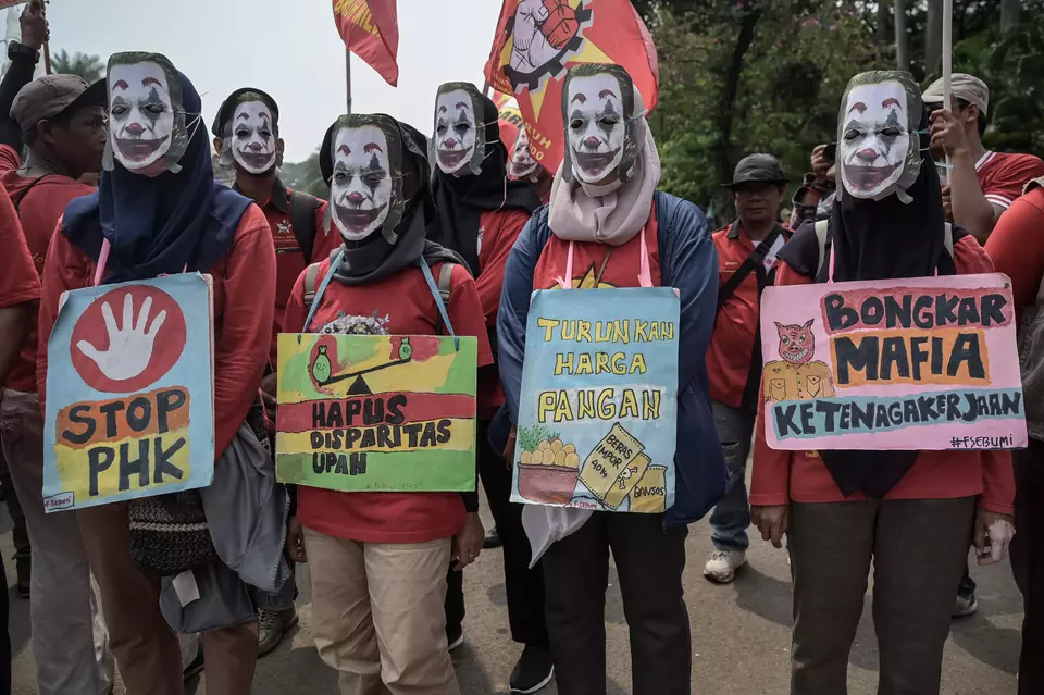 Workers join the May Day Rally wearing Joker masks at Jakarta's National Monument on May 1, 2025. The comic-book villain has become an icon in many government protests across the world. Some of the signs urge the government to stop the country's layoff waves and address the wage gap. (Antara Photo/Fauzan)