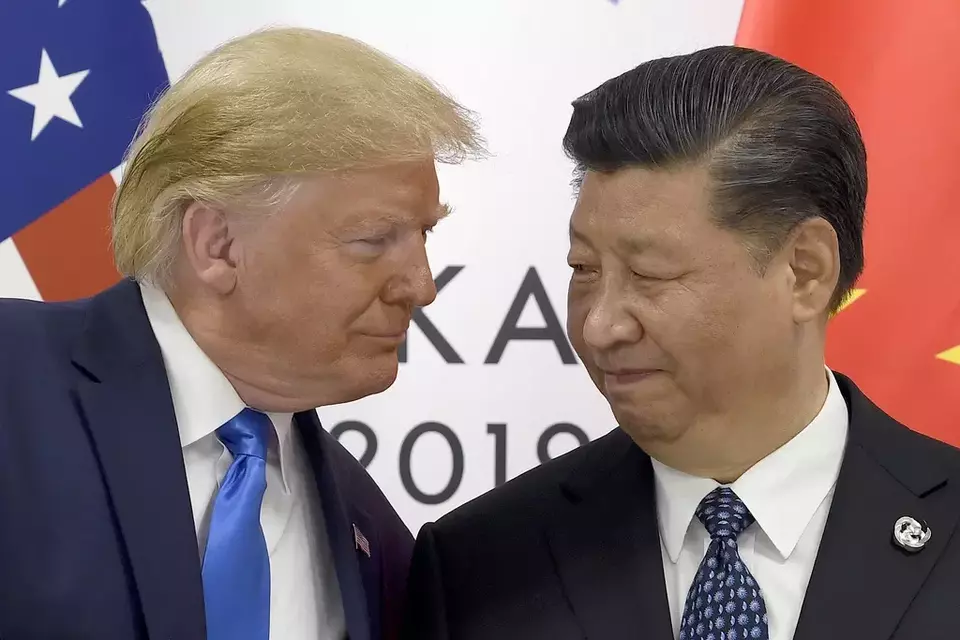 FILE - US President Donald Trump, left, meets with Chinese President Xi Jinping during a meeting on the sidelines of the G-20 summit in Osaka, Japan, June 29, 2019. (AP Photo/Susan Walsh, File)