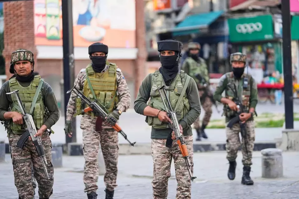 Indian soldiers guard at a market in Srinagar, Indian controlled Kashmir, Tuesday, May 6, 2025. (AP Photo/Mukhtar Khan)