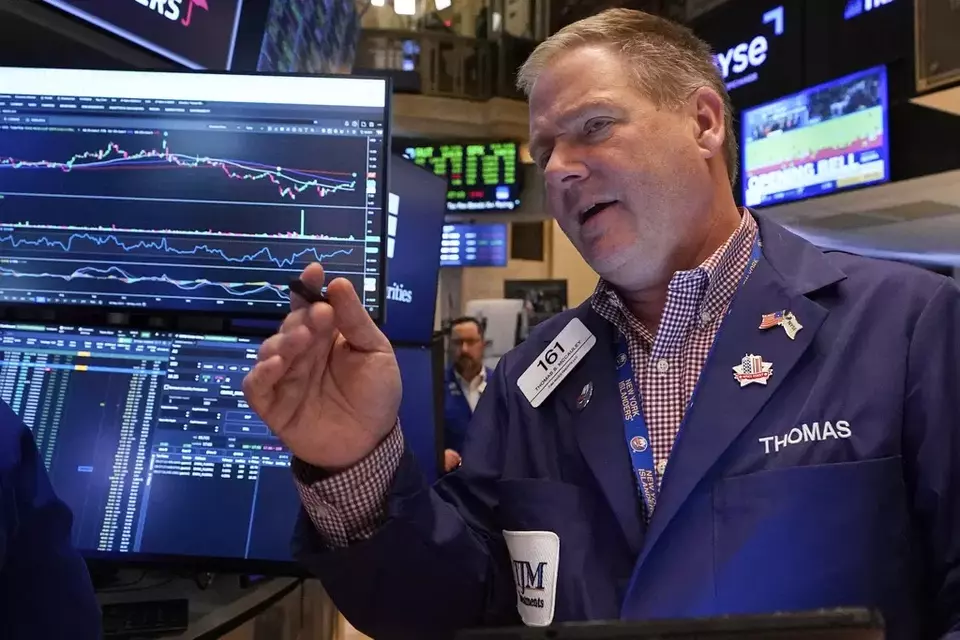 Trader Thomas McCauley works on the floor of the New York Stock Exchange, Friday, May 9, 2025. (AP Photo/Richard Drew)
