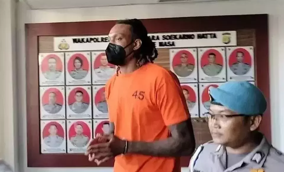 American basketball player Jarred Dwayne Shaw, a member of the Tangerang Hawks in the Indonesian Basketball League, is escorted to the police station of Soekarno-Hatta Airport in Tangerang, Banten, Wednesday, May 14, 2025. (B-Universe Photo/Wahroni)