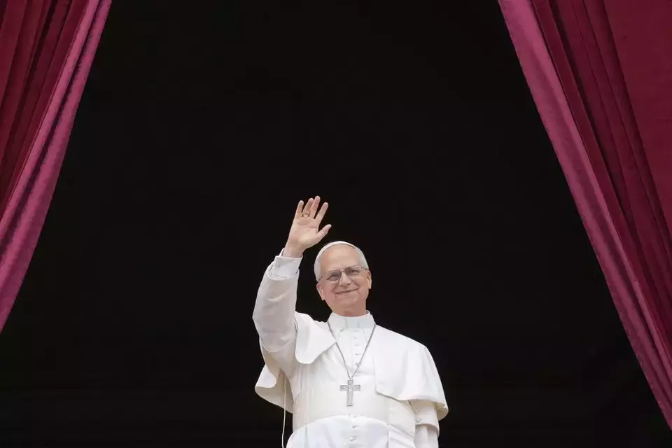 Pope Leo XIV appears on the central balcony of St. Peter's Basilica at the Vatican to bless the crowd below on May 11, 2025. (AP Photo/Gregorio Borgia)

