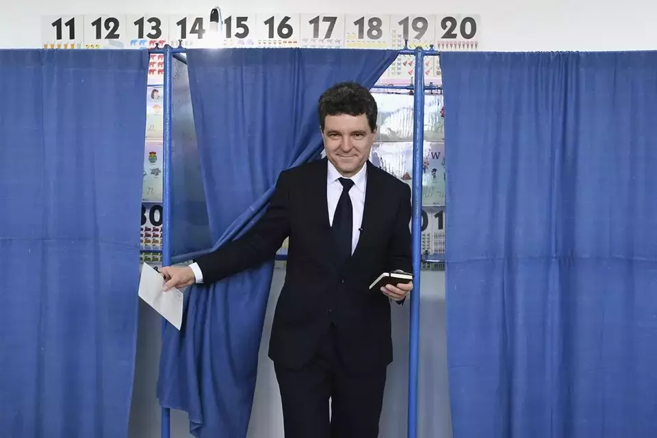 Presidential candidate Nicusor Dan exits a voting cabin before casting his vote in the second round of the country's presidential election redo in Fagaras, Romania, Sunday, May 18, 2025. (AP Photo/Eduard Vinatoru)