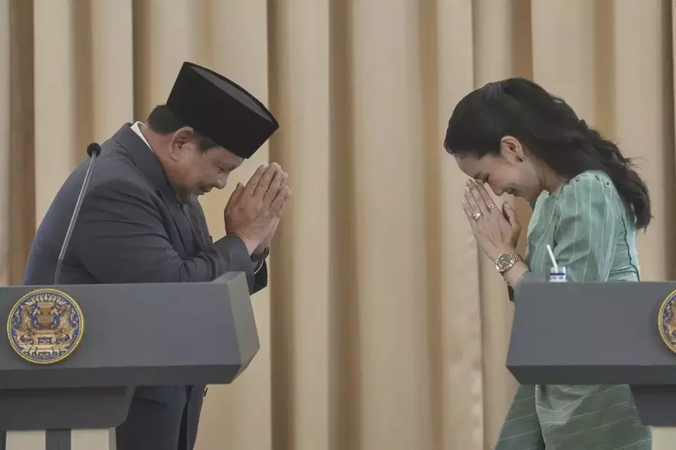 Indonesian President Prabowo Subianto, left, greets with Thai way tradition 'Wai' to Thailand's Prime Minister Paetongtarn Shinawatra after their joint press conference at the government house in Bangkok, Thailand, Monday, May 19, 2025. (AP Photo/Sakchai Lalit)