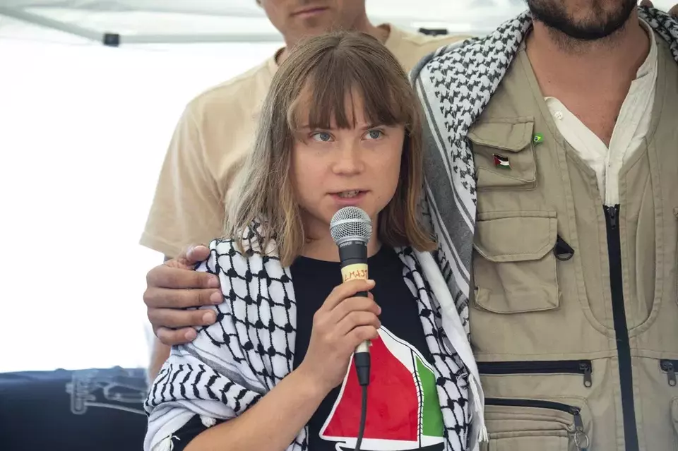 Climate activist Greta Thunberg, with other activists from a human rights organization, meets with journalists in Catania, Italy, Sunday, June 1, 2025, ahead of their departure for the Mideast. (AP Photo/Salvatore Cavalli)