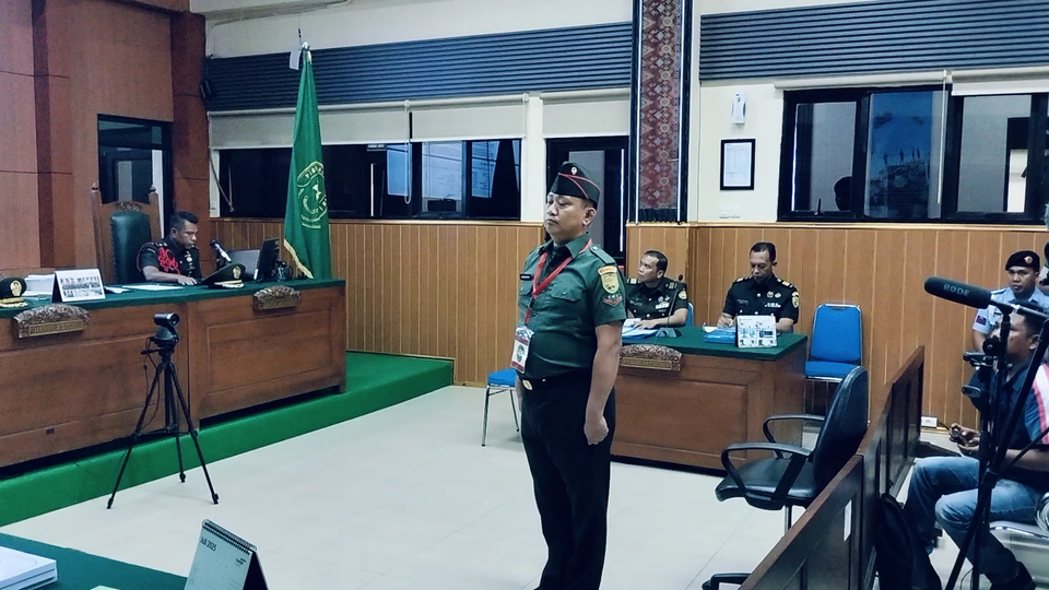 Corporal Bazarsah listens to the prosecution's demand in the trial over the fatal shooting of three police officers at Palembang Military Court I-04 on Monday, July 21, 2025. (Beritasatu.com/Andika Pratama)