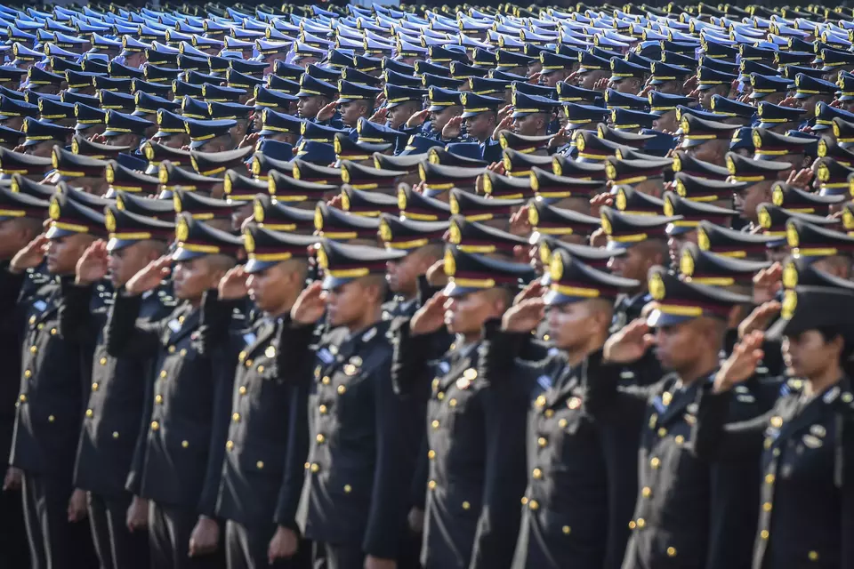 Young military and police cadets attend a ceremony for their inauguration as officers at the courtyard of the State Palace in Jakarta, Wednesday, July 23, 2025. (Antara Photo/Galih Pradipta)