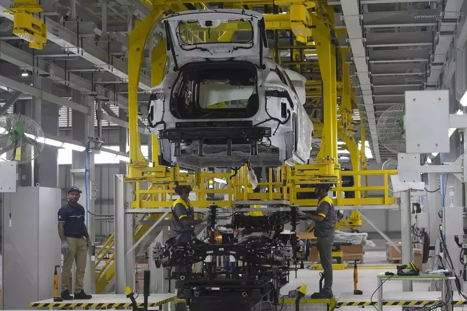 Workers assemble a car at the Vinfast electric vehicle plant in Thoothukudi, in the southern Indian state of Tamil Nadu, Monday, Aug. 4, 2025. (AP Photo/ Rafiq Maqbool)