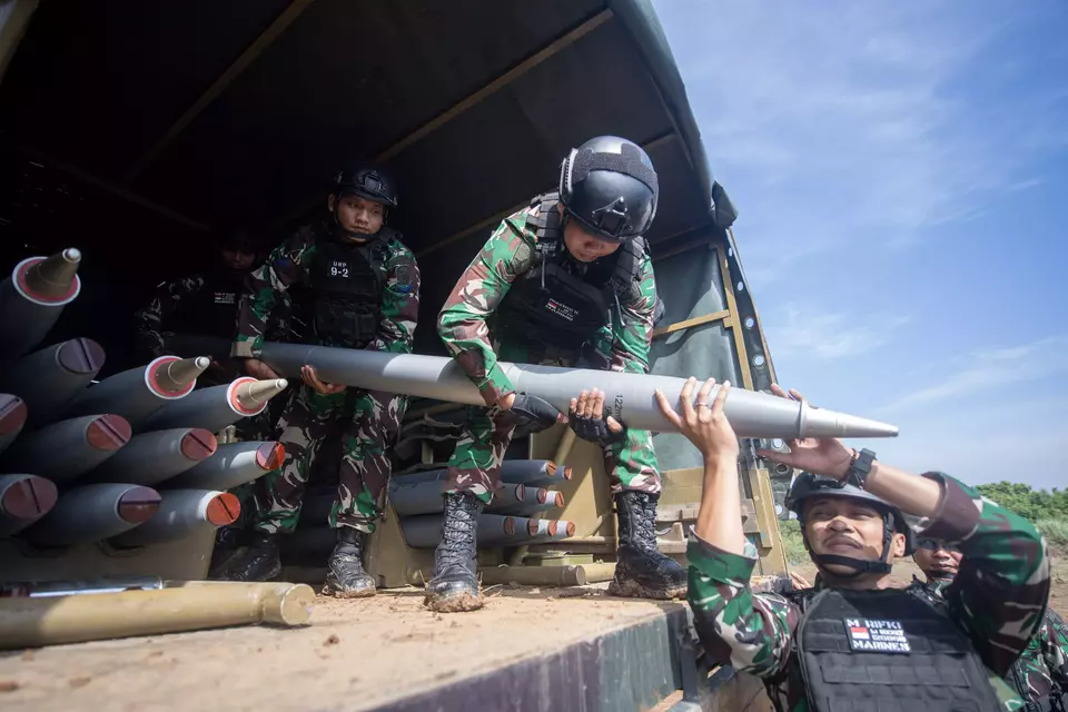 Indonesian soldiers unload rockets from a military truck during the joint military drill Super Garuda Shield in Martapura, Ogan Komering Ulu Timur, South Sumatra, on Monday, Sept. 1, 2025. (Antara Photo/Nova Wahyudi)