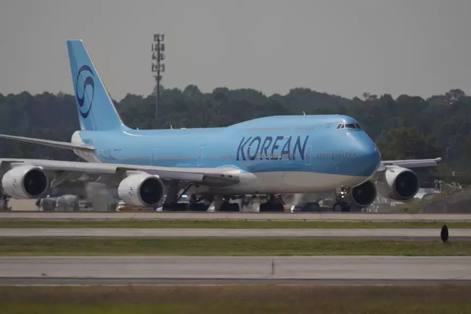 A plane prepares to take off with Korean workers who were detained at Hartsfield-Jackson International Airport in Atlanta, Thursday, Sept. 11, 2025. (AP Photo/George Walker IV)