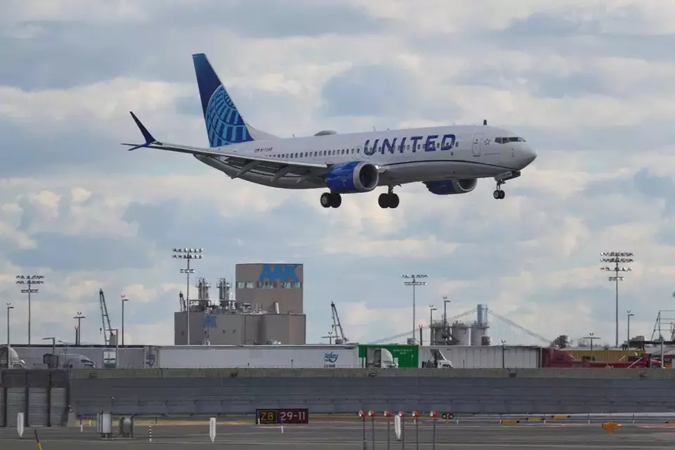 A plane lands at Newark International Airport in Newark, New Jersey, Thursday, Nov. 6, 2025. (AP Photo/Seth Wenig)
