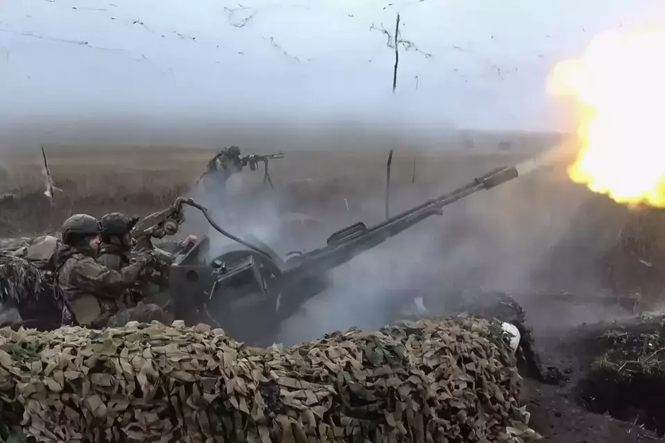 In this image made from video provided by Russian Defense Ministry Press Service on Nov. 7, 2025, Russian army soldiers fire to shoot a Ukrainian drone on an undisclosed location in Ukraine. (Russian Defense Ministry Press Service via AP)
