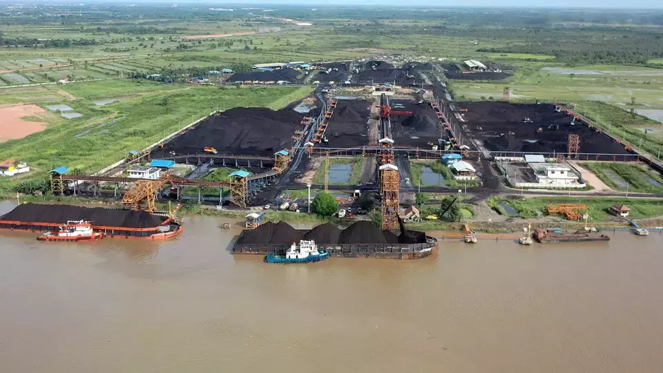 This undated photo provided by RMK Energy (RMKE) shows coal loading activities at a South Sumatra port. (Photo courtesy of RMKE)