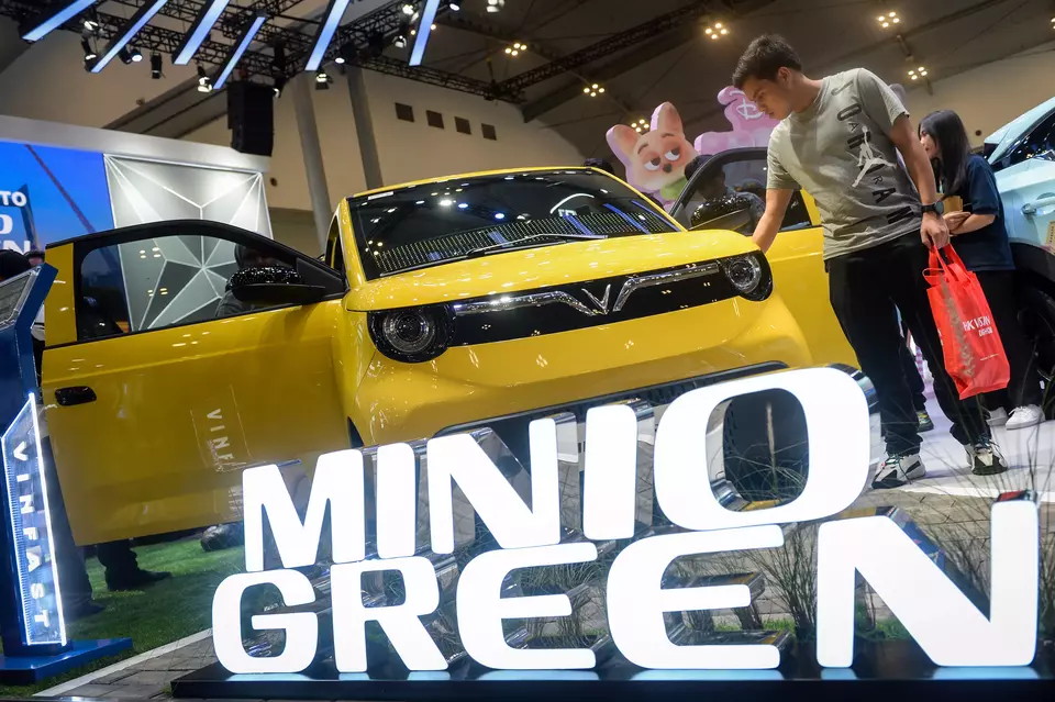 Visitors look at the VinFast Minio Green, the smallest electric vehicle produced by the Vietnamese automaker, at the Gaikindo Jakarta Auto Week in Tangerang, Banten, on Saturday, November 22, 2025. (Antara Photo/Putra M. Akbar)