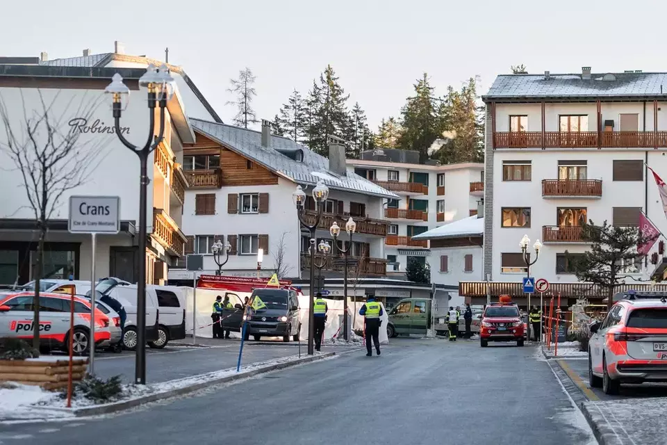 Police officers inspect the area where a fire broke out at the Le Constellation bar and lounge, leaving people dead and injured, during New Year's celebration, in Crans-Montana, Swiss Alps, Switzerland, Thursday, Jan. 1, 2026. (Alessandro della Valle/Keystone via AP)