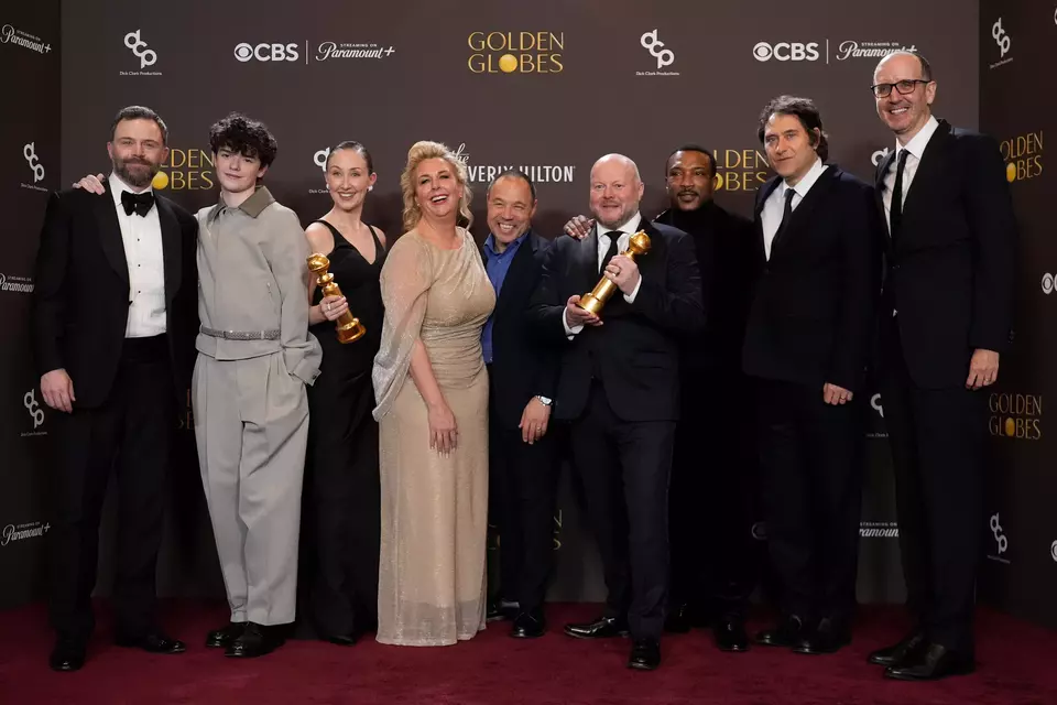 (L to R): Philip Barantini, Owen Cooper, Erin Doherty, Hannah Walters, Stephen Graham, Andy Cooper, Ashley Walters, Jeremy Kleiner, and Jack Thorne pose in the press room with the award for best television limited series made for television for "Adolescence" during the 83rd Golden Globes on Sunday, Jan. 11, 2026, at the Beverly Hilton in Beverly Hills, California. (AP Photo/Chris Pizzello)