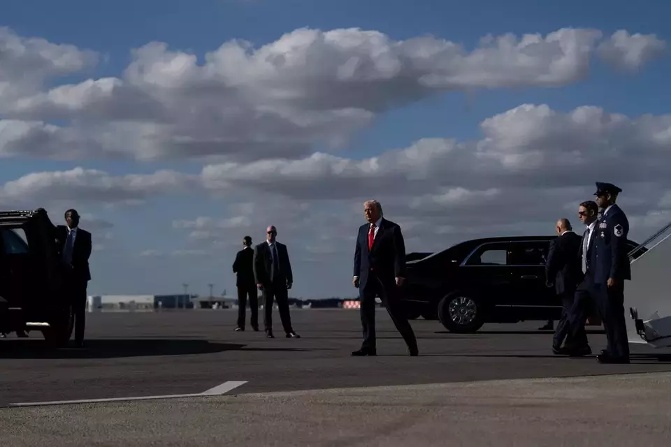 President Donald Trump walks to the presidential limousine, known as The Beast, after arriving to Palm Beach International Airport on Air Force One, Friday, Jan. 16, 2026, in West Palm Beach, Florida. (AP Photo/Julia Demaree Nikhinson)