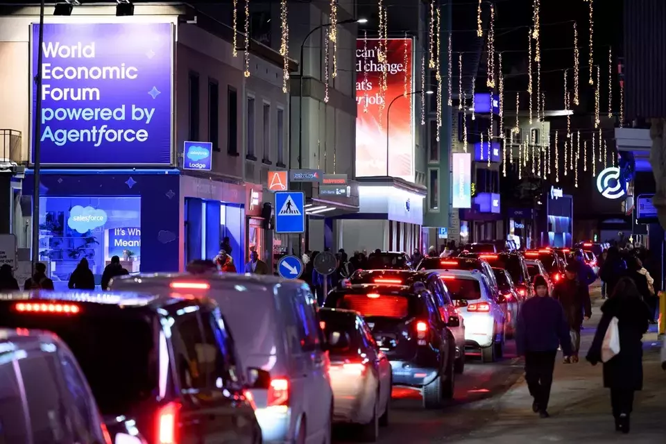 Cars are stuck in a traffic jam on the Promenade street prior to the annual meeting of the World Economic Forum (WEF) in Davos, Switzerland, Monday, Jan. 19, 2026. (Laurent Gillieron/Keystone via AP)