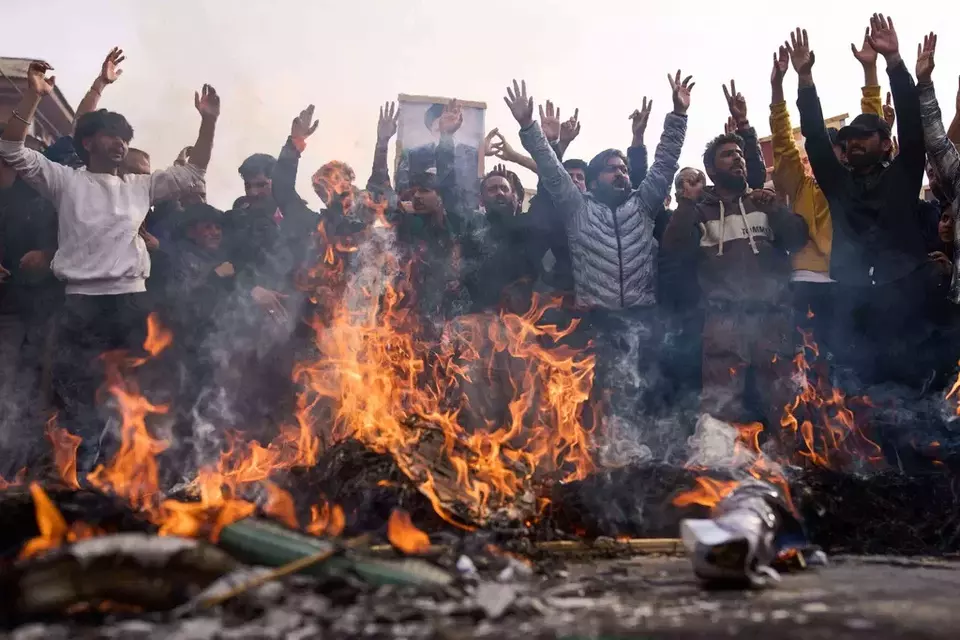 Shiite Muslims shout slogans as they burn effigies of President Donald Trump and Israeli Prime Minister Benjamin Netanyahu during a protest against the killing of Iran's Supreme Leader Ayatollah Ali Khamenei, in Budgam, northeast of Srinagar, Indian controlled Kashmir, Friday, March 6, 2026. (AP Photo/Dar Yasin)

