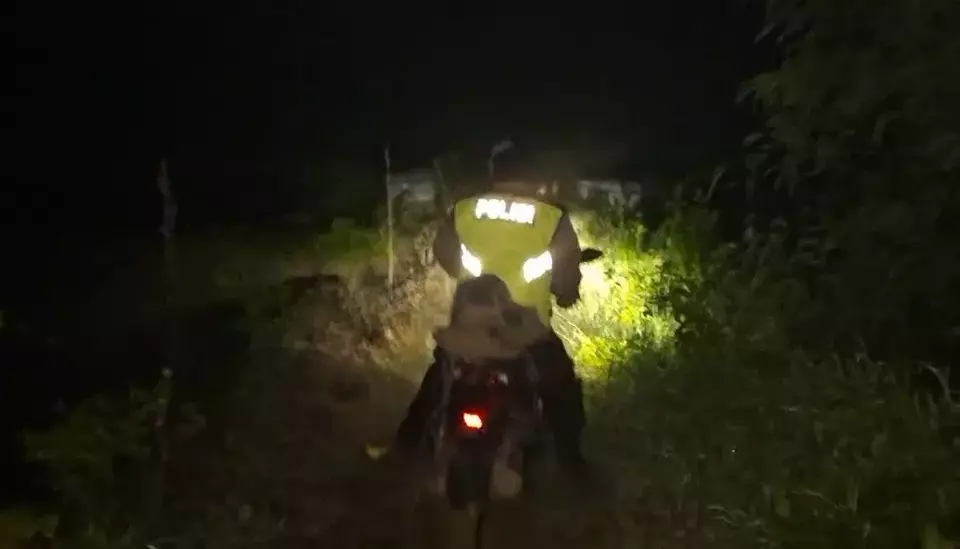 Bodeh police officers respond to an evacuation request for a family of motorcycle travelers lost in a dark, remote forest in Pemalang on Sunday, March 22, 2026. (Handout/Bodeh Police)