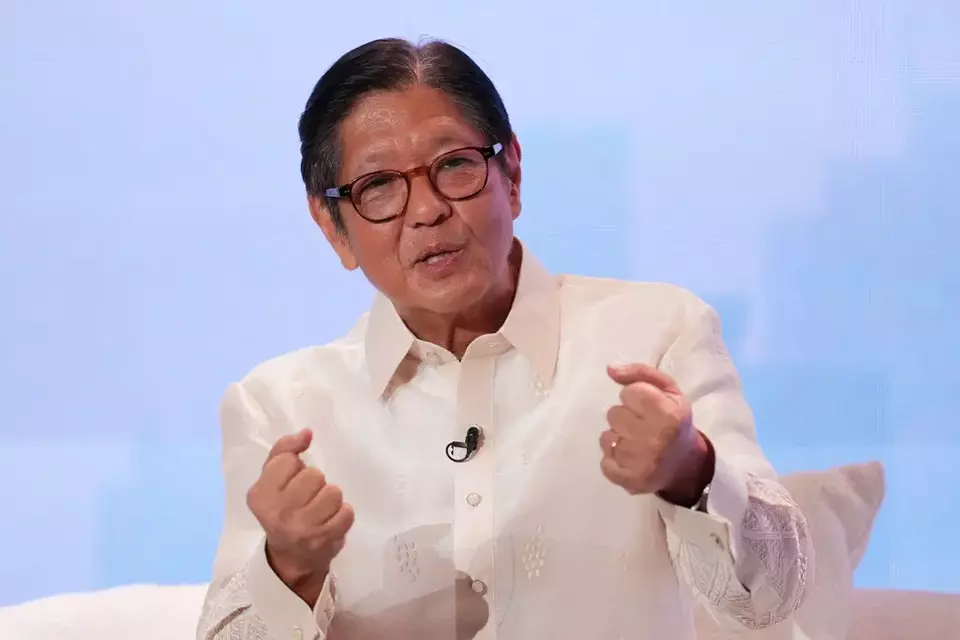 Philippine President Ferdinand Marcos Jr. gestures as he answers questions at the ASEAN Editors and Economic Opinon Leaders Forum in Makati, Philippines on Tuesday, Feb. 24, 2026. (AP Photo/Aaron Favila)
