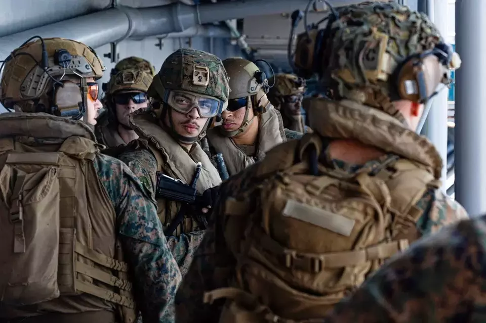 This image from video provided by US Central Command shows US Sailors and Marines aboard USS Tripoli (LHA 7) arriving in the US Central Command area of responsibility, March 27, 2026. (US Central Command via AP)