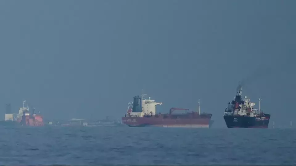 Oil tankers and cargo ships line up in the Strait of Hormuz as seen from Khor Fakkan, United Arab Emirates, on March 11, 2026. (AP Photo/Altaf Qadri,  File)