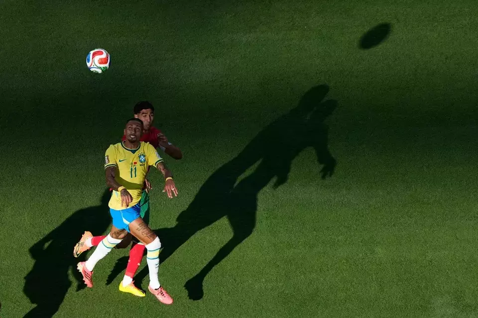 Brazil's Raphinha (11) and Morocco's Achraf Hakimi go up for a head ball during the World Cup Group C soccer match in East Rutherford, N.J., near New York, Saturday, June 13, 2026. (AP Photo/Matt Slocum)