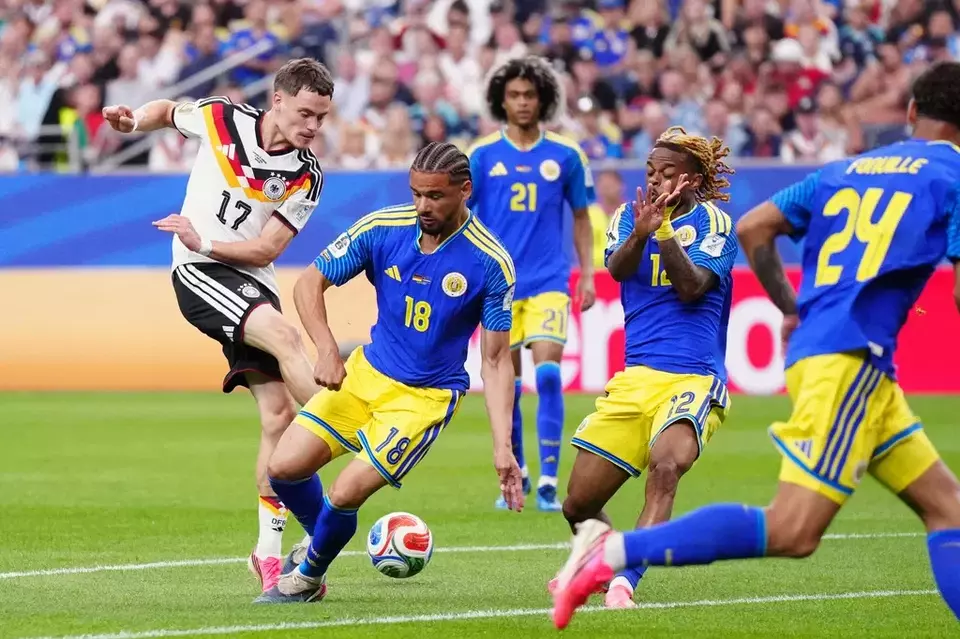 Germany's Florian Wirtz, left, attempts a shot at goal during the World Cup Group E soccer match between Germany and Curacao in Houston, Sunday, June 14, 2026. (AP Photo/Karen Warren)

